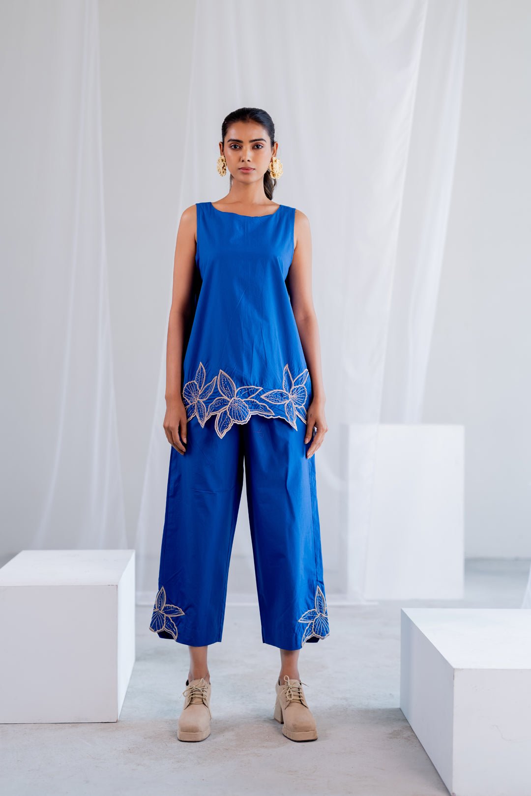 Blue Sleeveless A-Line Kurta Set with Embroidered Hem