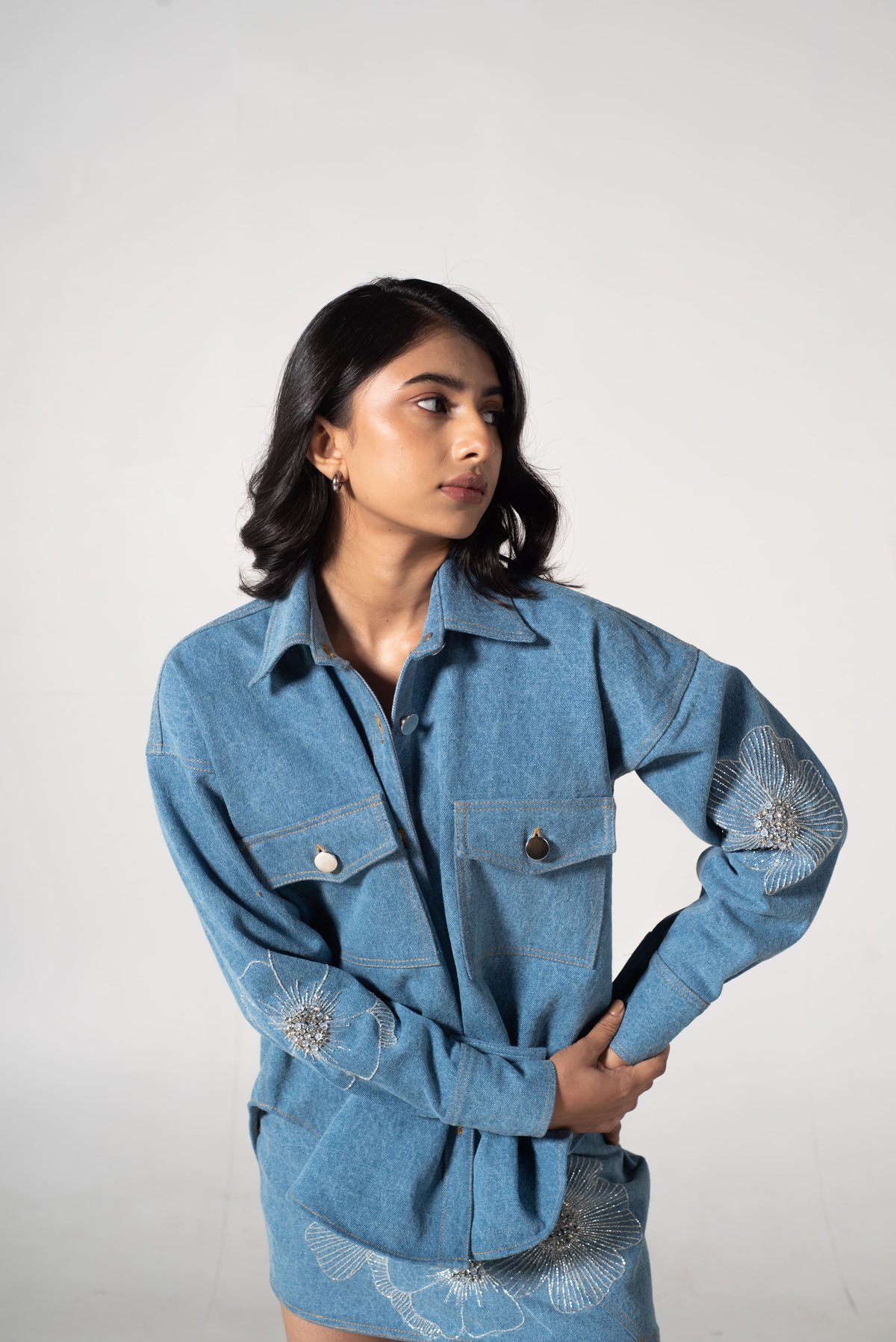 Light Blue Denim Mini Skirt with Floral Embellishments