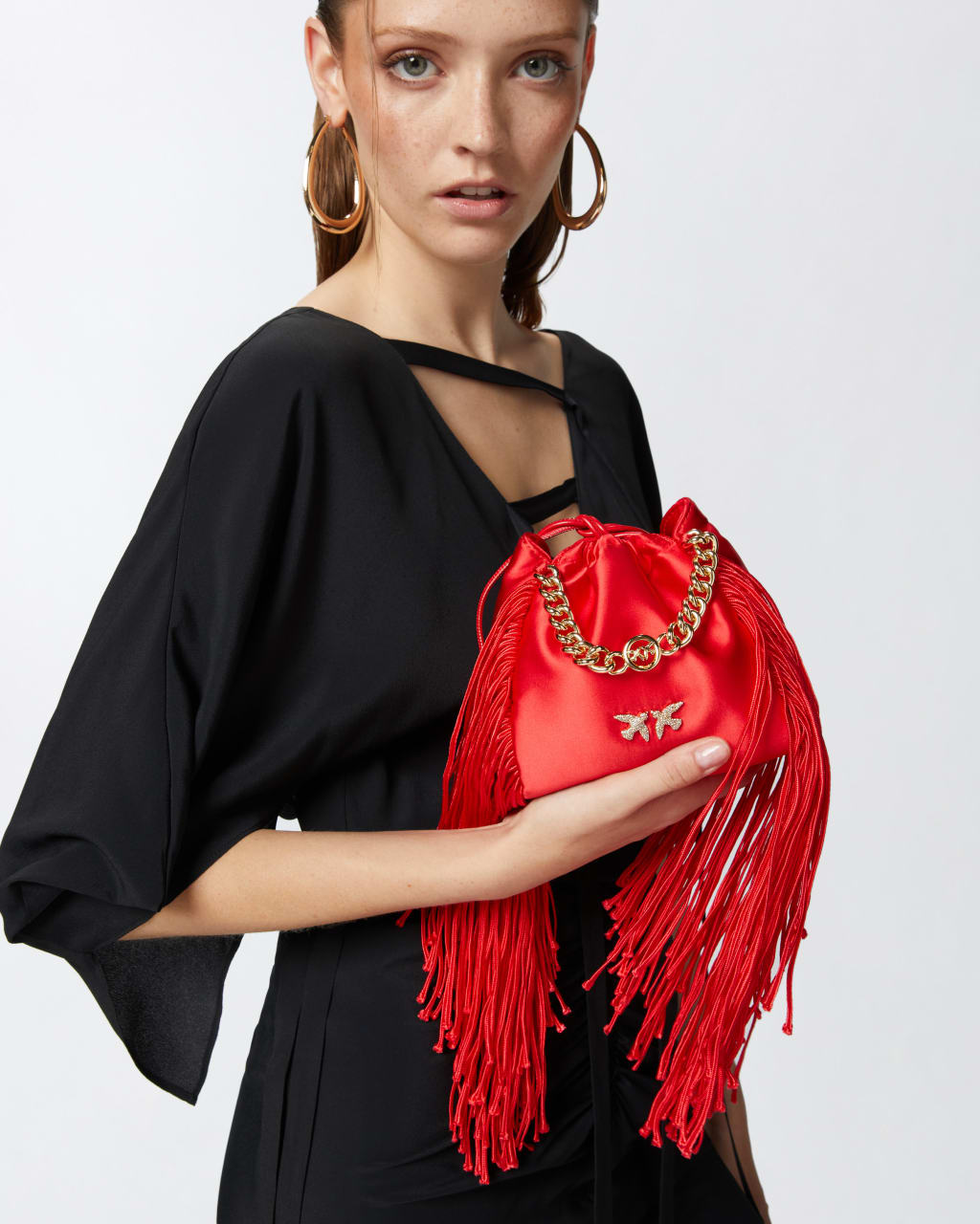 Mini satin clutch bag with fringes