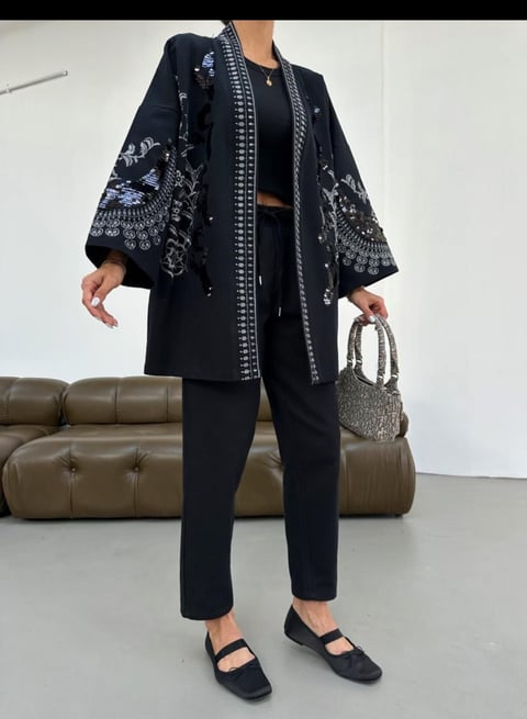 Black Embellished Shrug With Intricate Sequin Detailing And Flared Sleeves