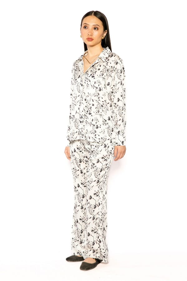Ivory Abstract Printed Flared Satin Trousers — Contemponari