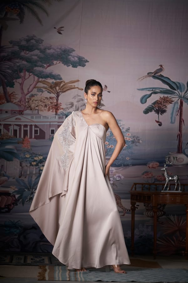Champagne One-Shoulder Satin Maxi Gown with Cape Drape — AMRTA BY GUNEET KONDAL