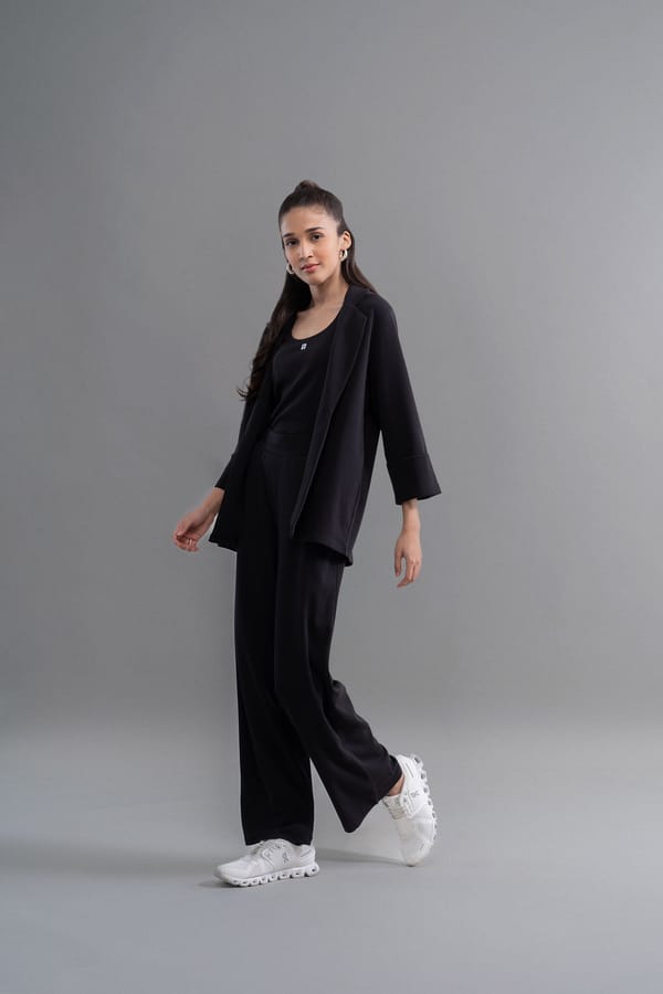 Black Flared Interlock Knit Trousers — Necesera