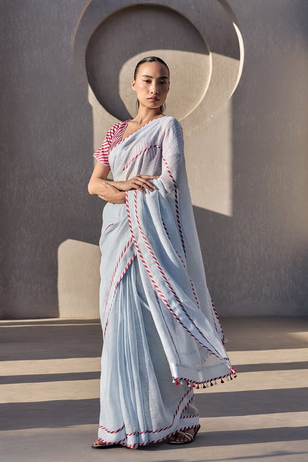 Powder Blue Linen Saree with Striped Border and Tassels — YELL