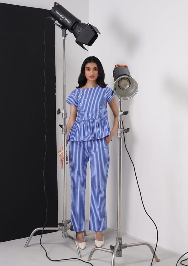 Blue and White Striped Peplum Top with Pearl Detail — AMOSHI