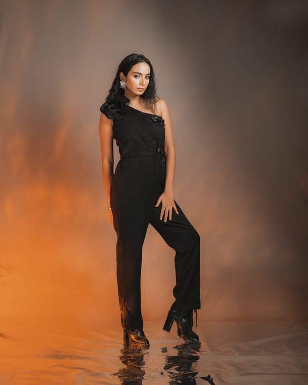 Black One-Shoulder Crepe Jumpsuit with 3D Flower — Darling Girl