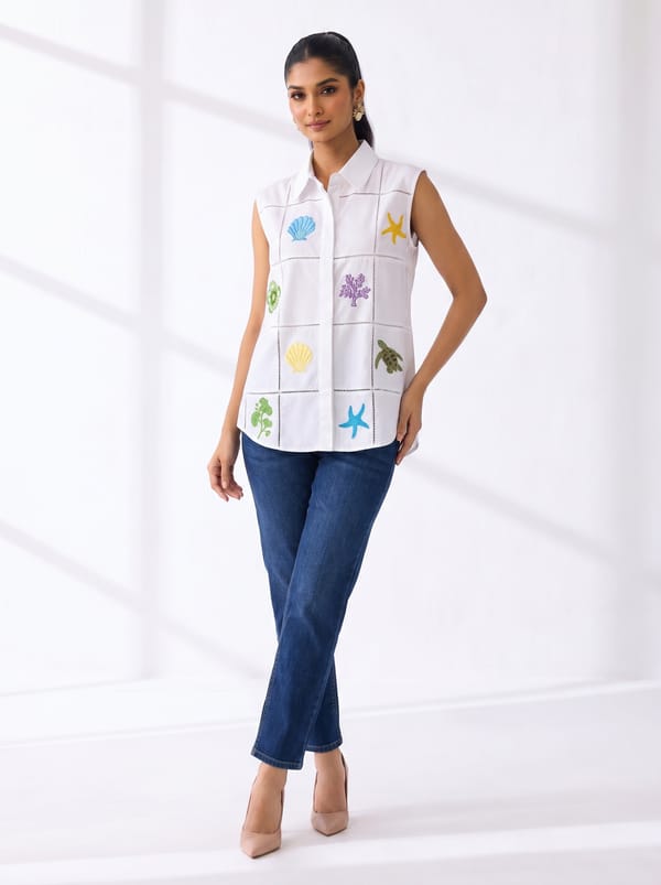 White Sleeveless Collared Shirt with Embroidered Motifs — Ang-sa