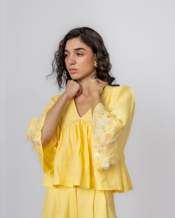 Butter Yellow Linen Peplum Top with Sequin Sleeve Detail — MAGIA