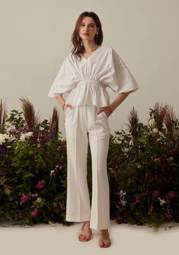 White High-Rise Flared Trousers with Pintuck Detail — AMOSHI