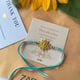 Lotus Motif Rakhi Gold color