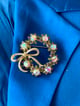 Snowflake Bow Studded Round Brooch Multicolor color