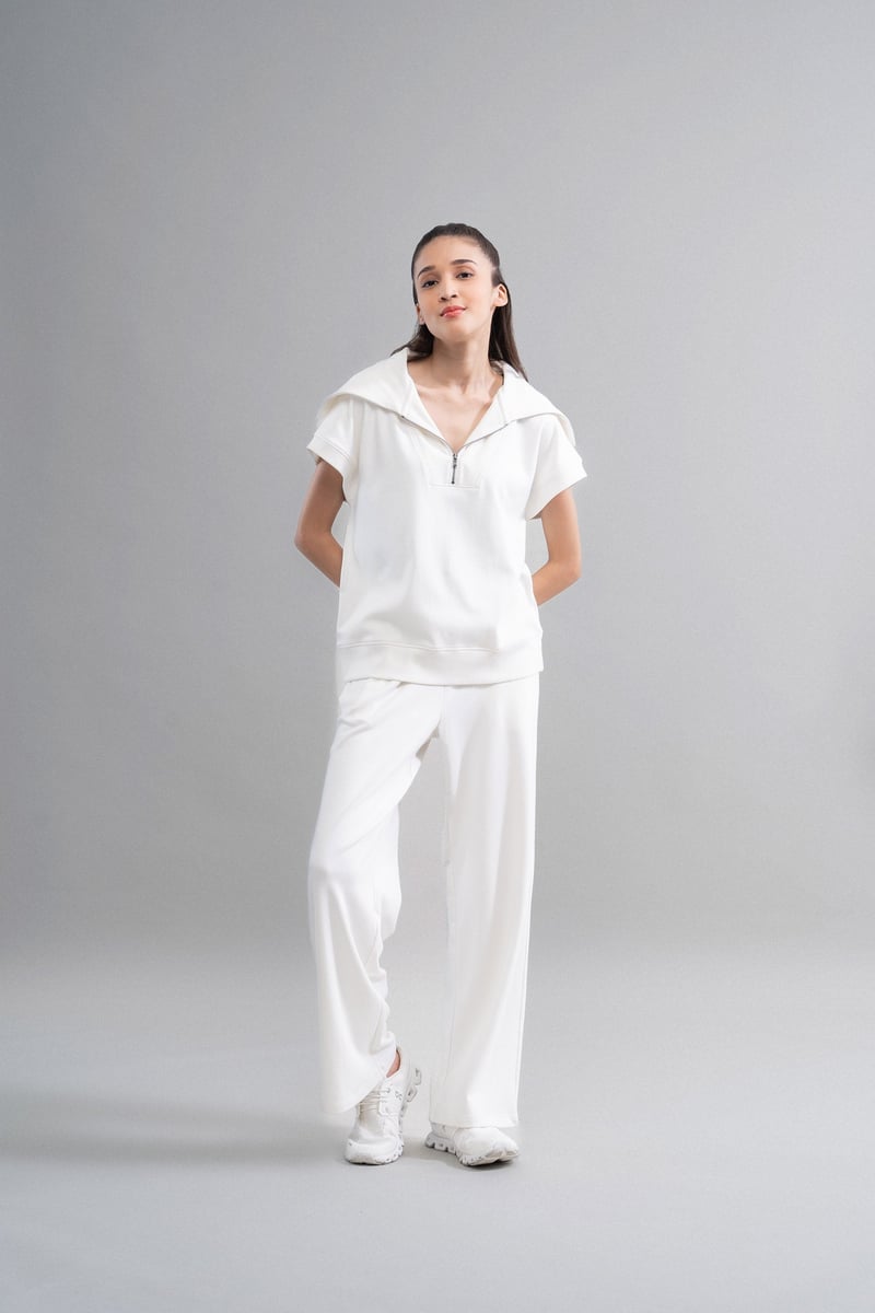 Ivory High-Rise Flared Knit Trousers with Pockets