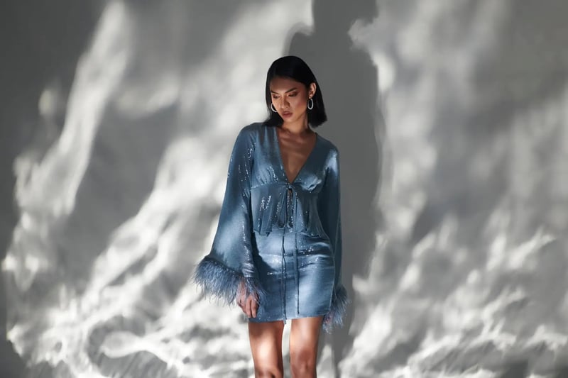 Belle Blue Sequin Tie-Front Peplum Top with Feather Cuffs