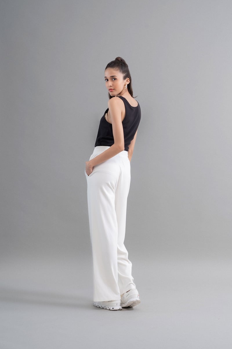 Ivory High-Rise Flared Knit Trousers with Pockets