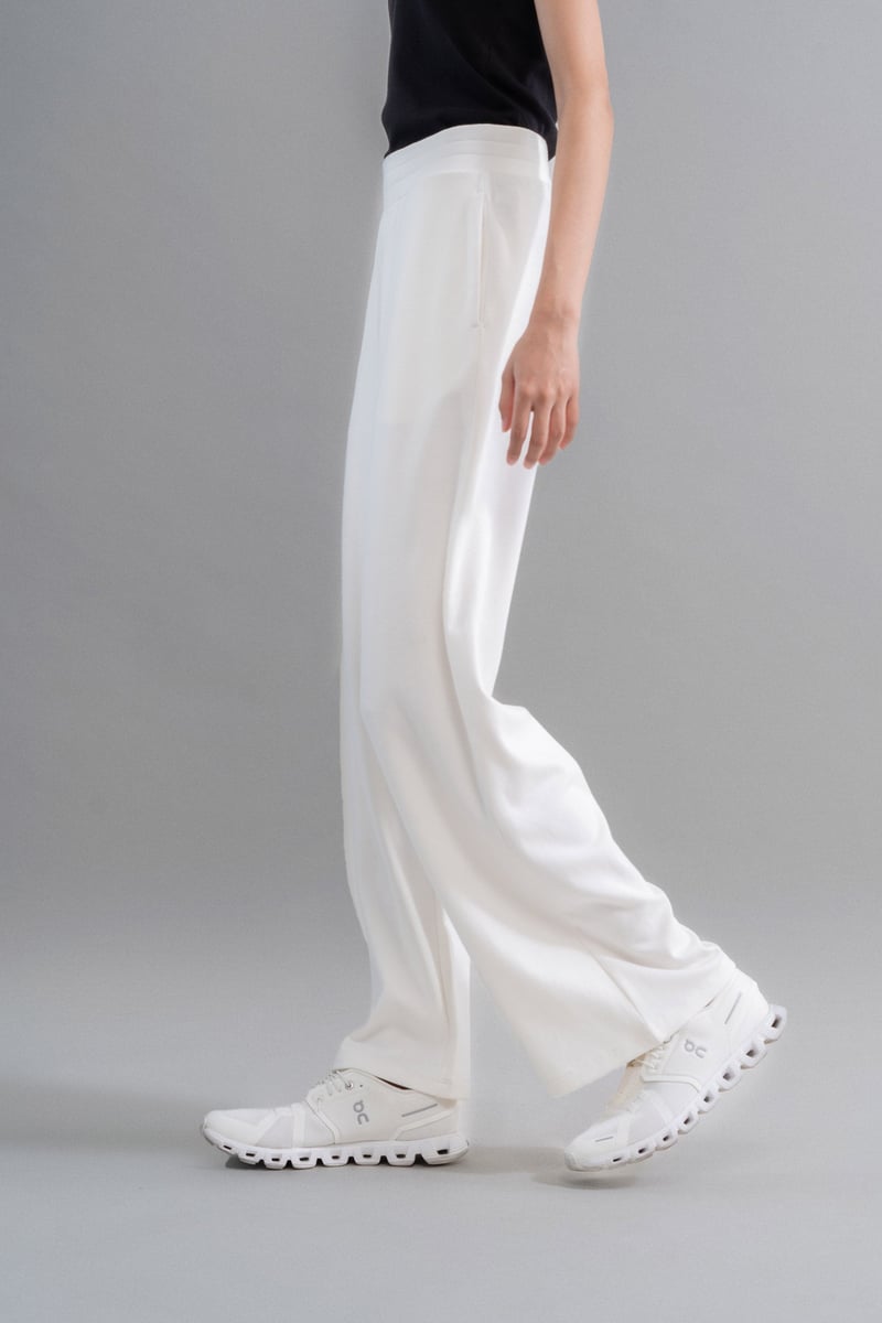 Ivory High-Rise Flared Knit Trousers with Pockets